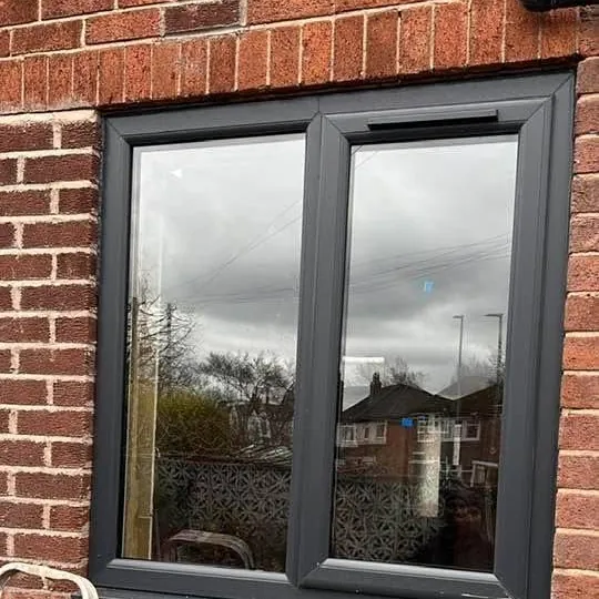 Anthracite grey uPVC window in brickwork