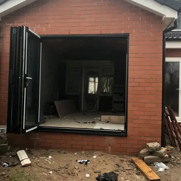 Bifold doors folded open on a brick extension