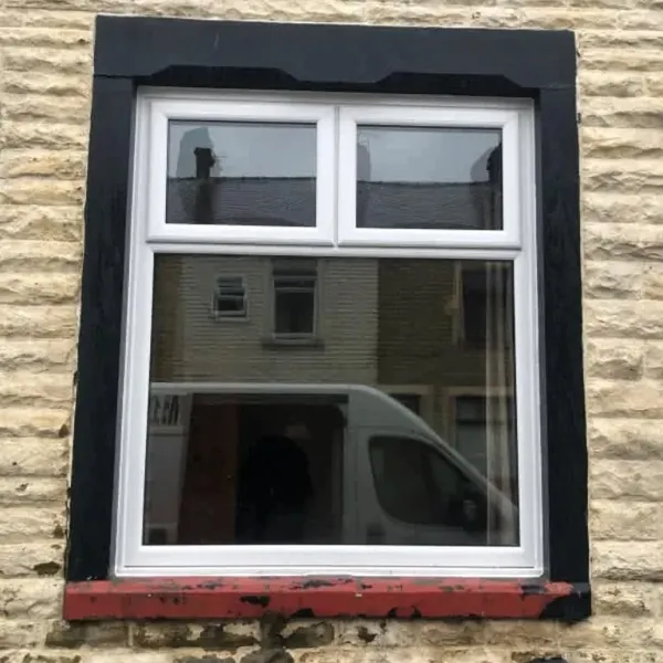White uPVC window in a stone house