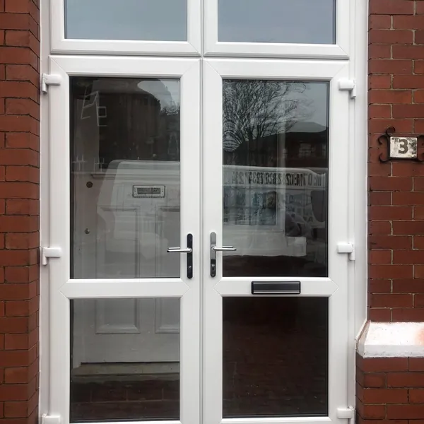 White uPVC French doors with top lights