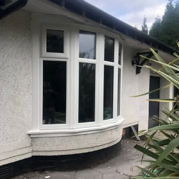 White uPVC bay window on a rendered house